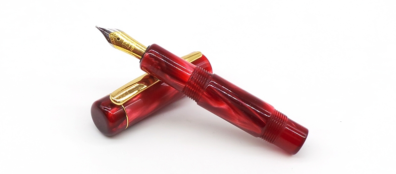 A custom pocket pen by John Garnham - Kirinite Rioja Pearl with Beaufort size 5 nib